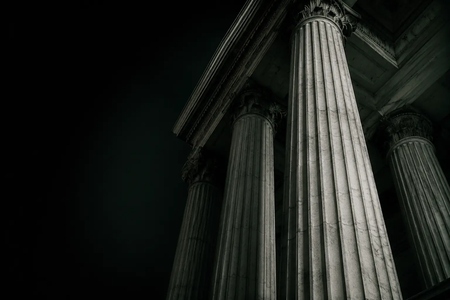 Classic white marble government columns standing under high-contrast dark twilight, symbolizing institutional strength and political strategy.
